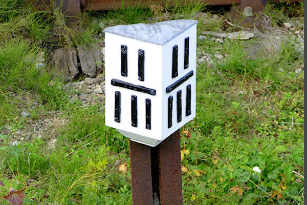 Winchcombe milepost 11¾ (from Honeybourne) on old broad gauge rail - Tim Edmonds