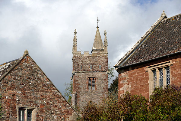 Cothelstone church tower  between cottages and Manor. - Tim Edmonds