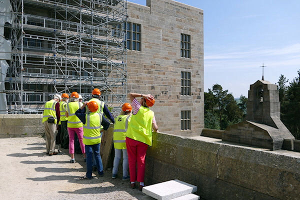 Castle Drogo WSNTA group by restored chapel roof  pondering the scaffolding - Tim Edmonds