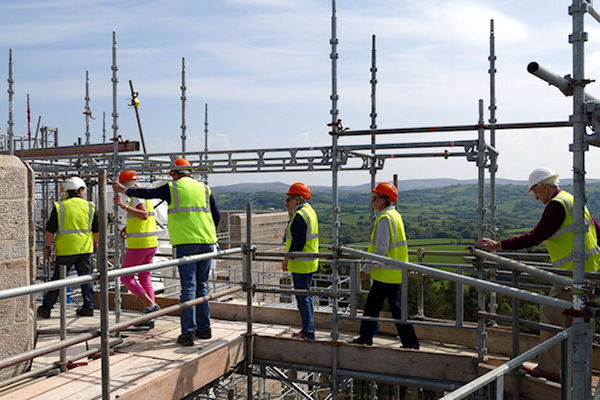 Castle Drogo WSNTA group on scaffolding walkway with  Dartmoor backdrop - Tim Edmonds