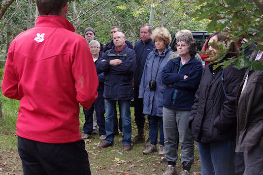 The group listening to explanation of charcoal production -  David Beach